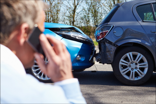 Man on phone after a Fender Bender