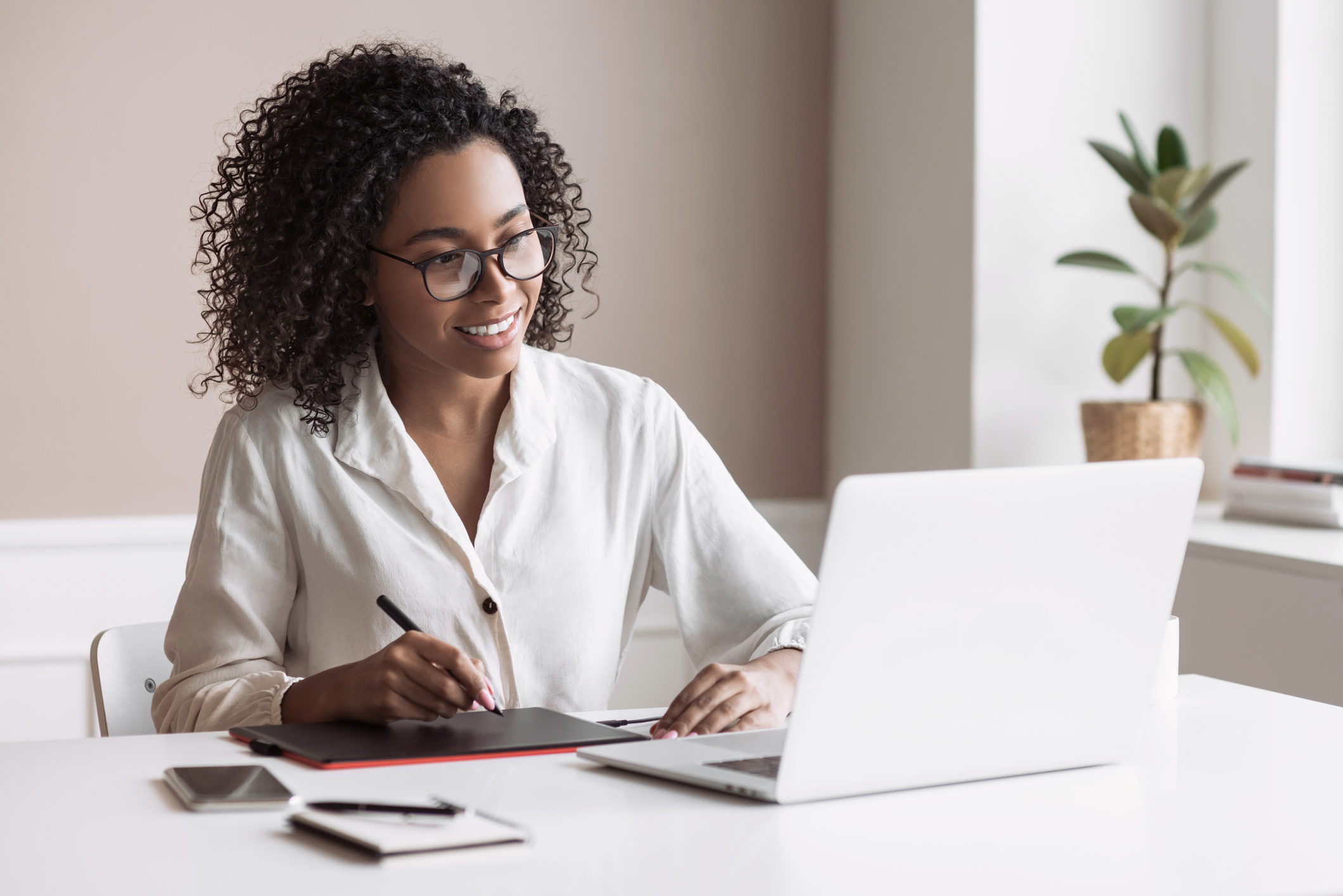 Woman working at a laptop