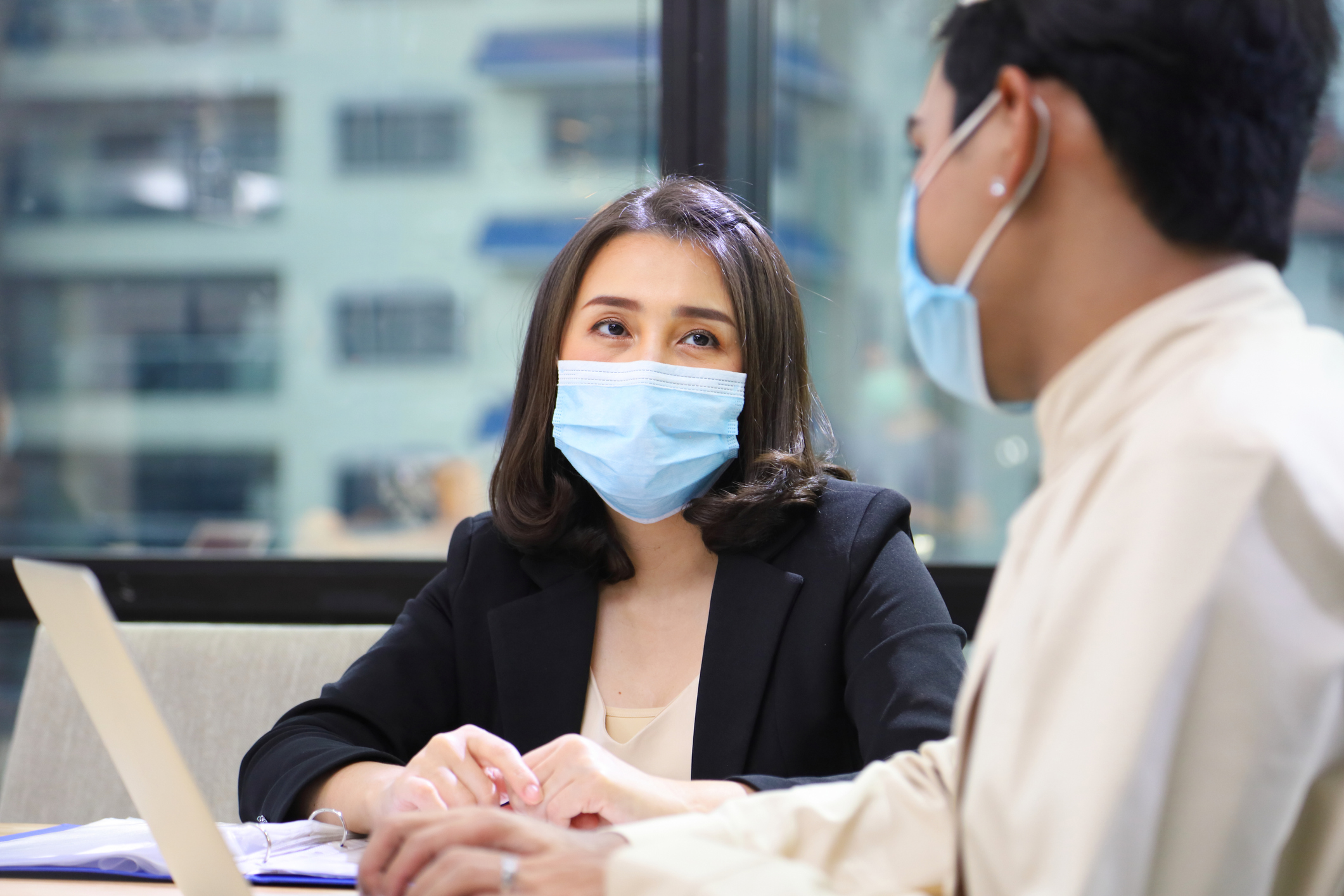 Meeting with a Lawyer wearing protective facemask