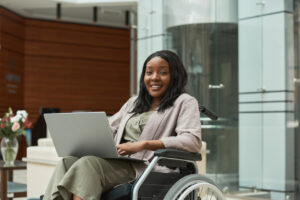 Woman in wheelchair with laptop