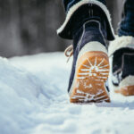 Winter boots walking in snow.