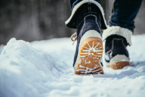 Winter boots walking in snow.